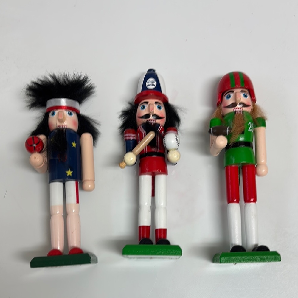 Football, baseball and basketball nutcracker figures